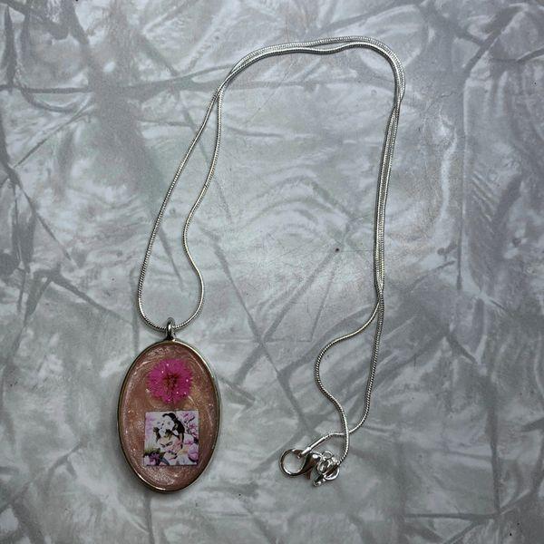 Frida Kahlo: Peach Oval Frida with Pink Flower